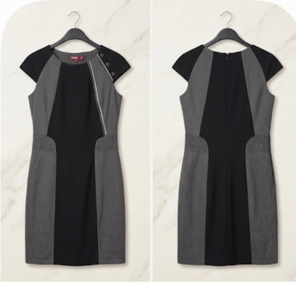 Robe droite ajustée grise et noire, parfaite pour le travail. Coupe très flatteuse grâce aux empiècements noirs latéraux qui affinent visuellement la silhouette. Jolis détails décoratifs : fermeture é...